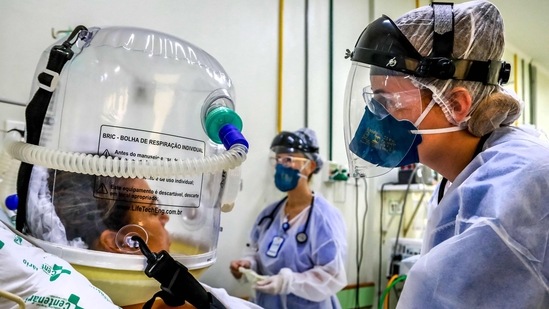 A Covid-19 patient uses a new non-invasive technology that can reduce the need of intubation at Centenario Hospital in Sao Leopoldo, Rio Grande do Sul state, southern Brazil on April 16. The true number of deceased is believed to be significantly higher because of under reporting and the many cases overlooked in the early stages of the outbreak that began in Wuhan, China, at the end of 2019. (Silvio Avila / AFP)