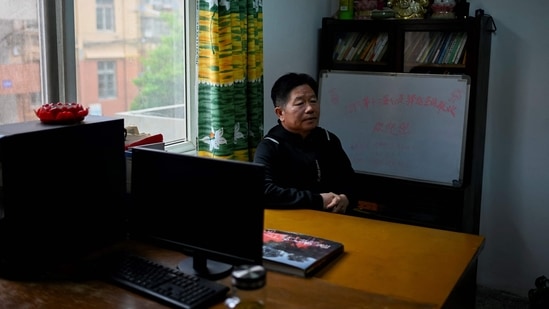 Chen Si speaks during an interview with AFP at his office in Nanjing, Jiangsu province, on April 1. Growing up in poverty in rural Jiangsu province helped Chen understand people's desperation, describing himself as "a farmer from the village (with) a foothold in the city".(Wang Zhao / AFP)