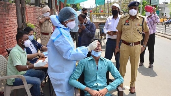 Commuters being tested for Covid-19 at a special camp outside the civil hospital in Ludhiana on Saturday. (Gurpreet Singh/HT) Commuters being tested for Covid-19 at a special camp outside the civil hospital in Ludhiana on Saturday. (Gurpreet Singh/HT)