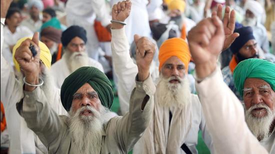 Farmers shout slogans at a site of a protest against the 2020 farm laws at Singhu border near New Delhi. (ANI)