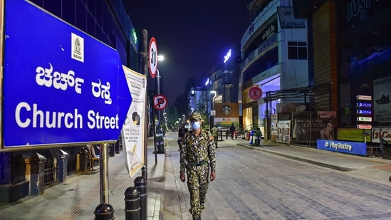 A deserted look of church street after the authorities announced the night curfew amid surge in coronavirus cases in Bengaluru. (PTI Photo)