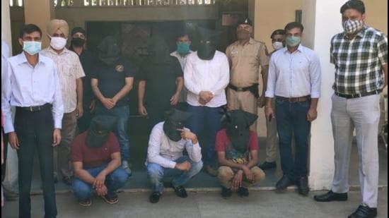 The accused in the custody of the Chandigarh Police on Sunday. (HT Photo)