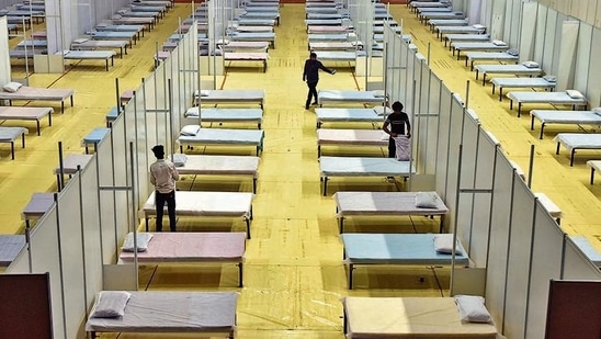 Beds being prepared inside the temporary Covid care centre, at Commonwealth Games Village Sports Complex, in New Delhi, India, on Sunday, April 18, 2021. (Photo by Sanjeev Verma/ Hindustan Times)