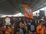 view of the crowd at a public rally by Prime Minister Narendra Modi, with people waving BJP flags, in Haldia, West Bengal in this file picture from February 2021. (Samir Jana / Hindustan Times)