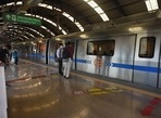 Commuters wearing face masks at Karkarduma Metro station. Commuters wearing face masks at Karkarduma Metro station.