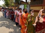 People in queues to cast their vote showing voter ID cards during the fifth phase of West Bengal assembly elections.(Samir Jana/HT Photo)