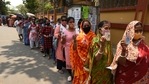 People in queues to cast their vote showing voter ID cards during the fifth phase of West Bengal assembly elections.(Samir Jana/HT Photo) People in queues to cast their vote showing voter ID cards during the fifth phase of West Bengal assembly elections.(Samir Jana/HT Photo)