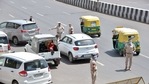 Delhi Police personnel check vehicle during a weekend lockdown, in New Delhi on Sunday. (ANI) Delhi Police personnel check vehicle during a weekend lockdown, in New Delhi on Sunday. (ANI)