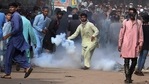 A supporters of Tehreek-e-Labiak Pakistan, a banned Islamist party, prepares to hurl back a tear gas canister fired by police to disperse protests over the arrest of their party leader Saad Rizvi.(AP) A supporters of Tehreek-e-Labiak Pakistan, a banned Islamist party, prepares to hurl back a tear gas canister fired by police to disperse protests over the arrest of their party leader Saad Rizvi.(AP)