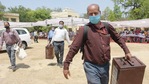Officials carry ballot boxes to polling stations ahead of the second phase of Uttar Pradesh panchayat elections, in Lucknow.(PTI) Officials carry ballot boxes to polling stations ahead of the second phase of Uttar Pradesh panchayat elections, in Lucknow.(PTI)