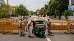 Delhi Police officers stop an autorickshaw at a check point during a weekend lockdown in New Delhi, India, Saturday, April 17, 2021. (AP) Delhi Police officers stop an autorickshaw at a check point during a weekend lockdown in New Delhi, India, Saturday, April 17, 2021. (AP)