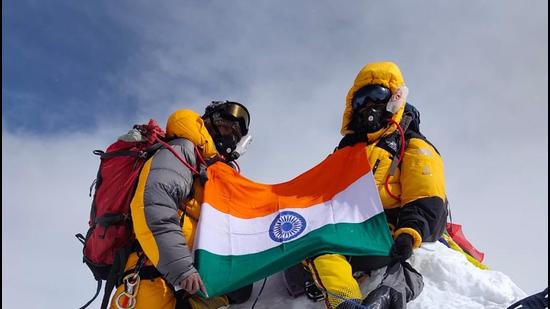 Two members of the Indian mountaineering team summit Annapurna peak. (HT photo)