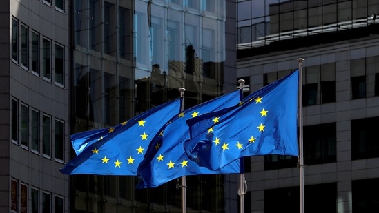 European Union flags flutter outside the European Commission headquarters in Brussels, Belgium.(Reuters)