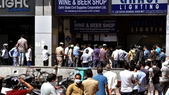 On Monday as soon as Delhi chief minister Arvind Kejriwal announced a six-day lockdown a sudden rush of punters was seen outside liquor shops in the national capital with long queues. (ANI Photo) On Monday as soon as Delhi chief minister Arvind Kejriwal announced a six-day lockdown a sudden rush of punters was seen outside liquor shops in the national capital with long queues. (ANI Photo)