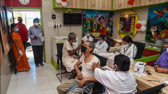 Beneficiaries receive their second dose of Covid-19 vaccine at a government dispensary in Patna on Sunday, April 18. (PTI) Beneficiaries receive their second dose of Covid-19 vaccine at a government dispensary in Patna on Sunday, April 18. (PTI)