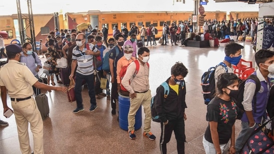 Migrants arriving from Maharashtra wait in a queue for Covid-19 test at Patna railway station, amid a countrywide spike in coronavirus cases, in Patna.(PTI)