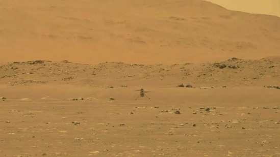 In this image from Nasa, Nasa's experimental Mars helicopter Ingenuity lands on the surface of Mars.(AP)