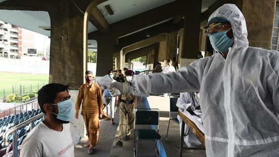 A man undergoes thermal screening at a special Covid-19 helpdesk.(Vipin Kumar/HT file photo)