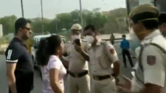 The man has been identified as Pankaj Dutta, a resident of West Patel Nagar. His wife Abha Yadav is seen arguing with the policemen on duty on Sunday.(Videograb) The man has been identified as Pankaj Dutta, a resident of West Patel Nagar. His wife Abha Yadav is seen arguing with the policemen on duty on Sunday.(Videograb)