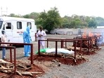 People perform last rites to the victims who died due to Covid-19 amid the surge in cases, at a crematorium in Bhopal. (ANI Photo)