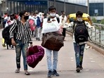 Migrant workers arrive at Kaushambi Anand Vihar Bus Terminal to leave for their home town after the six-day lockdown imposed by the Delhi government amid the rise in coronavirus cases, New Delhi, (ANI)