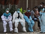 Covid-19 health workers take a rest in-between work in New Delhi, India, on Monday, April 19, 2021. Covid-19 health workers take a rest in-between work in New Delhi, India, on Monday, April 19, 2021.