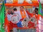 The BJP has set a target of the distribution of six crore masks and sanitisers in West Bengal. In picture - BJP national president JP Nadda in a road show in Birbhum district.(PTI)