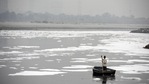 A man rows a boat in the heavily polluted waters of the Yamuna River. (Biplov Bhuyan/HT Photo) A man rows a boat in the heavily polluted waters of the Yamuna River. (Biplov Bhuyan/HT Photo)