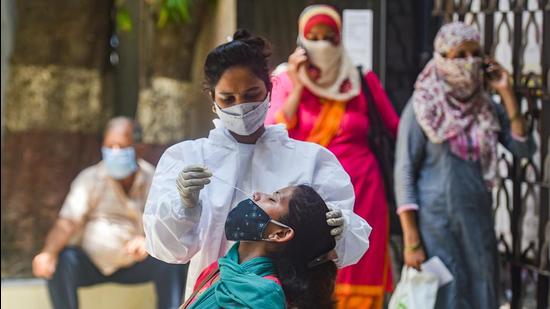 File photo: A medic conducts Covid-19 testing. (PTI) File photo: A medic conducts Covid-19 testing. (PTI)