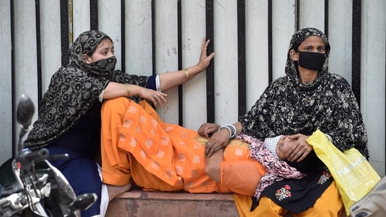 Grieving relatives and family members of a person who died of Covid-19, break down outside the LNJP Hospital mortuary while waiting to collect the body, in New Delhi on April 19. As of April 20, there are a total of 2,031,977 active cases across the country, the highest active caseload ever recorded in India since the start of the outbreak in March last year, according to the health ministry’s update.(Ajay Aggarwal / HT Photo)