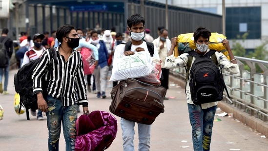 Migrant workers arrive at Kaushambi Anand Vihar Bus Terminal to leave for their home town after the six-day lockdown imposed by the Delhi government amid the rise in coronavirus cases, New Delhi, (ANI) Migrant workers arrive at Kaushambi Anand Vihar Bus Terminal to leave for their home town after the six-day lockdown imposed by the Delhi government amid the rise in coronavirus cases, New Delhi, (ANI)