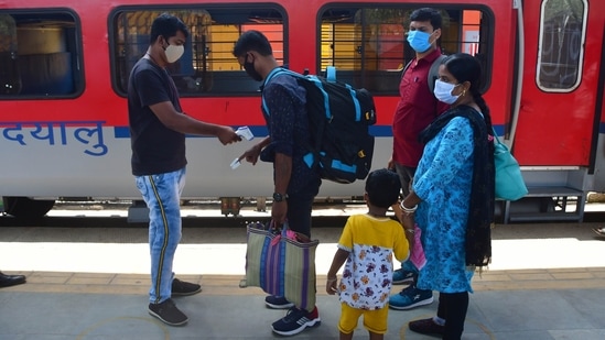 A traveler undergoes thermal screening, at Dadar Station in Mumbai on April 19. One of the major reasons to have caused an acute area-specific shortage of life-saving supplies is the uneven distribution of the active cases in the country. Maharashtra, for instance, is home to only 9% of the country’s population, but is currently bearing the load of one of every three (33.4%) active cases in India. (Bhushan Koyande / HT Photo)