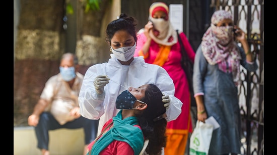 A medic conducts COVID-19 test, Mumbai, April 19, 2021 (PTI)