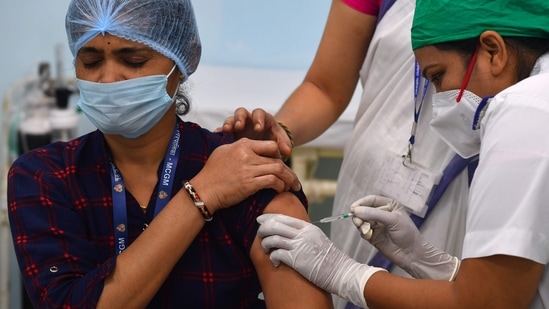 A medical worker inoculates a colleague with a Covid-19 coronavirus vaccine. (AFP file photo) A medical worker inoculates a colleague with a Covid-19 coronavirus vaccine. (AFP file photo)