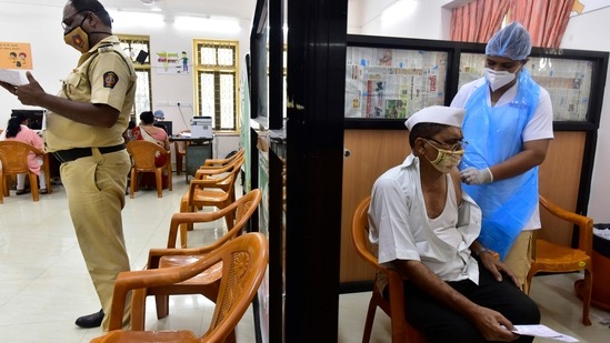 BMC medical staff administering a Covid-19 vaccine to a beneficiary at M. A. Podar Hospital in Mumbai on April 19. The Union government on April 19 said that all adults will be eligible for a coronavirus vaccine and doses can be sold via the market from May 1, heeding to a growing clamour for wider access as the country grapples with Covid-19 infections.(Anshuman Poyrekar / HT Photo)