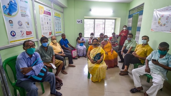 Kolkata: Beneficiaries wait at a health centre to receive the dose of Covid-19 vaccine amid surge in coronavirus cases, in Kolkata on Monday. (PTI Photo )