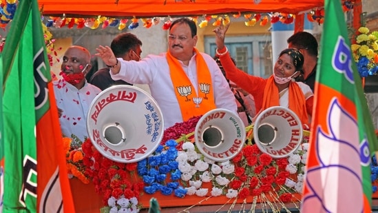 The BJP has set a target of the distribution of six crore masks and sanitisers in West Bengal. In picture - BJP national president JP Nadda in a road show in Birbhum district. (PTI) The BJP has set a target of the distribution of six crore masks and sanitisers in West Bengal. In picture - BJP national president JP Nadda in a road show in Birbhum district. (PTI)
