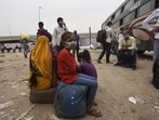 Migrant workers wait for public transport to their native places amid fears of total lockdown due to the sharp spike in coronavirus cases, at Rajiv Chowk Bus Stand, in Gurugram. (Vipin Kumar / Hindustan Times) Migrant workers wait for public transport to their native places amid fears of total lockdown due to the sharp spike in coronavirus cases, at Rajiv Chowk Bus Stand, in Gurugram. (Vipin Kumar / Hindustan Times)