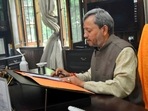 The revised standard operating procedures (SOPs) also makes it mandatory for all modes of public transport, including buses and auto rickshaws, to run at half their seating capacity. In picture - Uttarakhand chief minister Tirath Singh Rawat.