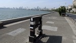 A deserted view of Marine Drive in Mumbai due to curfew-like restrictions which are already in place to curb the spread of the coronavirus.(ANI photo) A deserted view of Marine Drive in Mumbai due to curfew-like restrictions which are already in place to curb the spread of the coronavirus.(ANI photo)