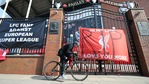 A man cycles past banners outside of Anfield Stadium, Liverpool, England protesting against the clubs decision to join the European Super Leaguer, Tuesday April 20, 2021.(AP) A man cycles past banners outside of Anfield Stadium, Liverpool, England protesting against the clubs decision to join the European Super Leaguer, Tuesday April 20, 2021.(AP)