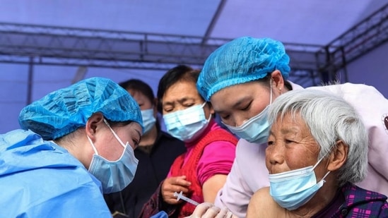 An elderly woman receives the China National Biotech Group Covid-19 coronavirus vaccine in China's southwestern Chongqing. (AFP) An elderly woman receives the China National Biotech Group Covid-19 coronavirus vaccine in China's southwestern Chongqing. (AFP)
