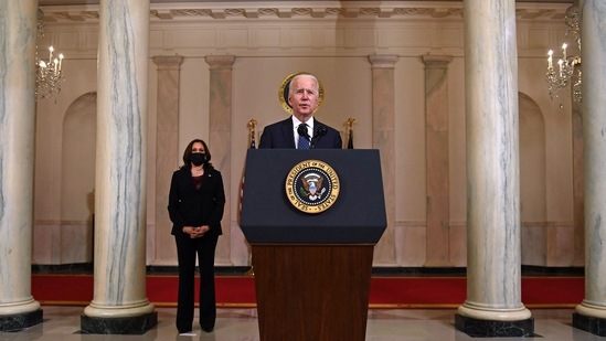 Vice President Kamala Harris (L) listens as US President Joe Biden delivers remarks on the guilty verdict against former policeman Derek Chauvin at the White House in Washington, DC on April 20. In his comments, Biden emphasized his support for legislation "to root out unconstitutional policing," including the George Floyd Justice in Policing Act, which seeks to increase accountability for law enforcement misconduct.(Brendan Smialowski / AFP)