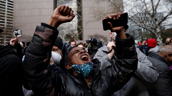 A person reacts after the verdict in the death of George Floyd, in front of Hennepin County Government Center, in Minneapolis on April 20. A 12-member jury found Chauvin, 45, guilty of all three charges of second-degree murder, third-degree murder and manslaughter after considering three weeks of testimony from 45 witnesses, including bystanders, police officials and medical experts.(Carlos Barria / REUTERS)