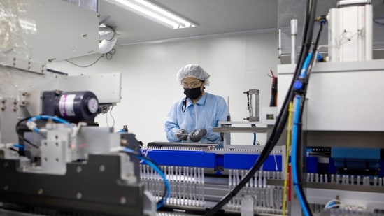 An employee works on a production line for low dead space syringes at a Shina Corp. factory in Gongju, South Korea. (Bloomberg) An employee works on a production line for low dead space syringes at a Shina Corp. factory in Gongju, South Korea. (Bloomberg)