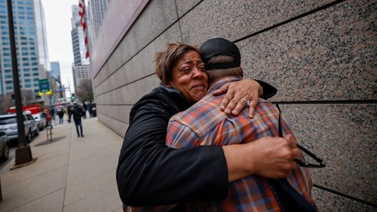 People hugging each other after learning of the verdict in the George Floyd trial, in front of Hennepin County Government Center, in Minneapolis on April 20. Crowds across America reacted with jubilation but also with deep awareness of the progress left to be made.(Carlos Barria / REUTERS)