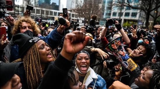 People celebrate as the verdict is announced in the trial of former police officer Derek Chauvin outside the Hennepin County Government Center in Minneapolis, Minnesota on April 20, 2021. (AFP) People celebrate as the verdict is announced in the trial of former police officer Derek Chauvin outside the Hennepin County Government Center in Minneapolis, Minnesota on April 20, 2021. (AFP)