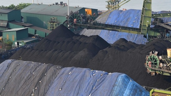 In this photograph taken on March 11, 2021 a shipment of coal is unloaded from a cargo vessel at the Mormugao Port Trust in Goa. (AFP)