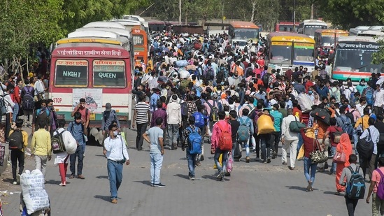 Large numbers of migrants at Kaushambi bus stand to board buses for their native place, after lockdown announcement in Delhi on Monday. (PTI Photo ) Large numbers of migrants at Kaushambi bus stand to board buses for their native place, after lockdown announcement in Delhi on Monday. (PTI Photo )