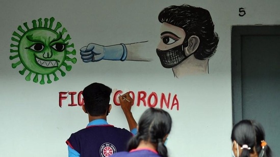 Tripura, NSS (National Service Scheme) volunteers and students paint on a wall to spread awareness about Covid-19 in Agartala (ANI) Tripura, NSS (National Service Scheme) volunteers and students paint on a wall to spread awareness about Covid-19 in Agartala (ANI)